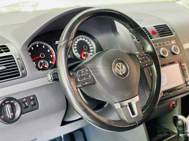 Volkswagen Touran 1.4i AMT (149 л.с.) 2012 г.